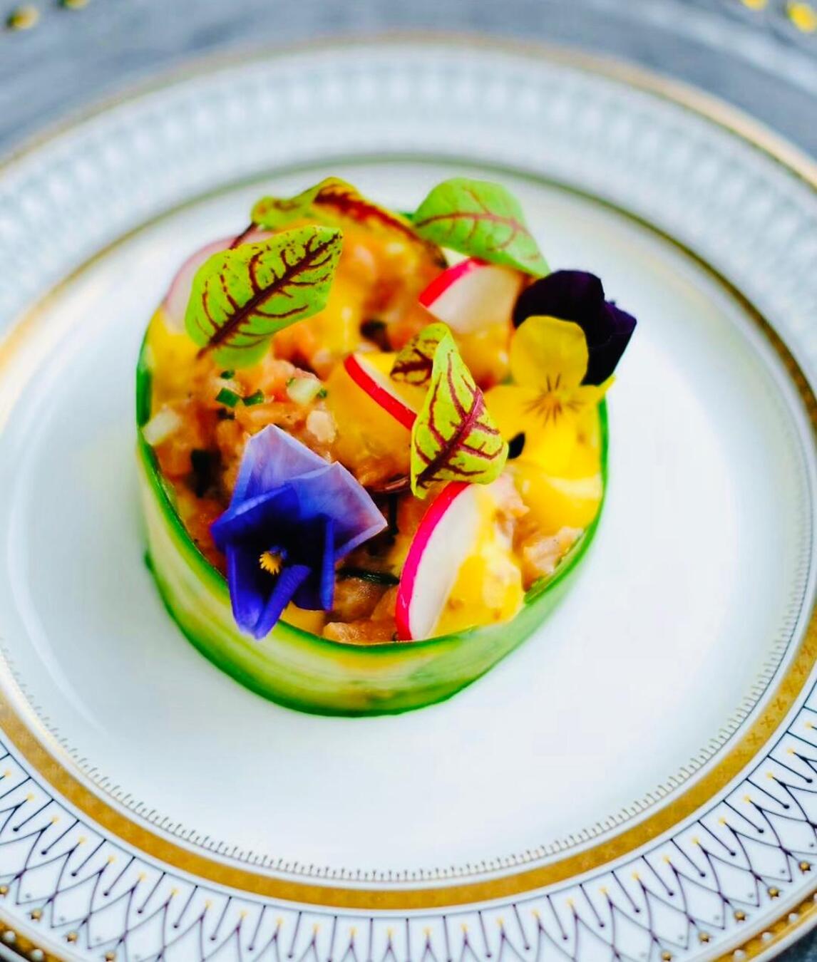 Cucumber-wrapped tuna tartare with mango and radish